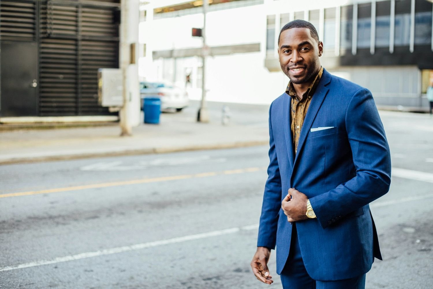 Entrepreneur in a blue suit on a city street