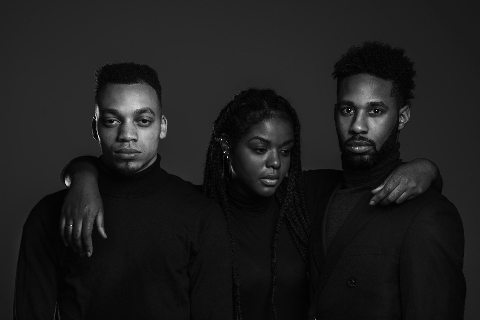 Portrait of three creatives dressed in black