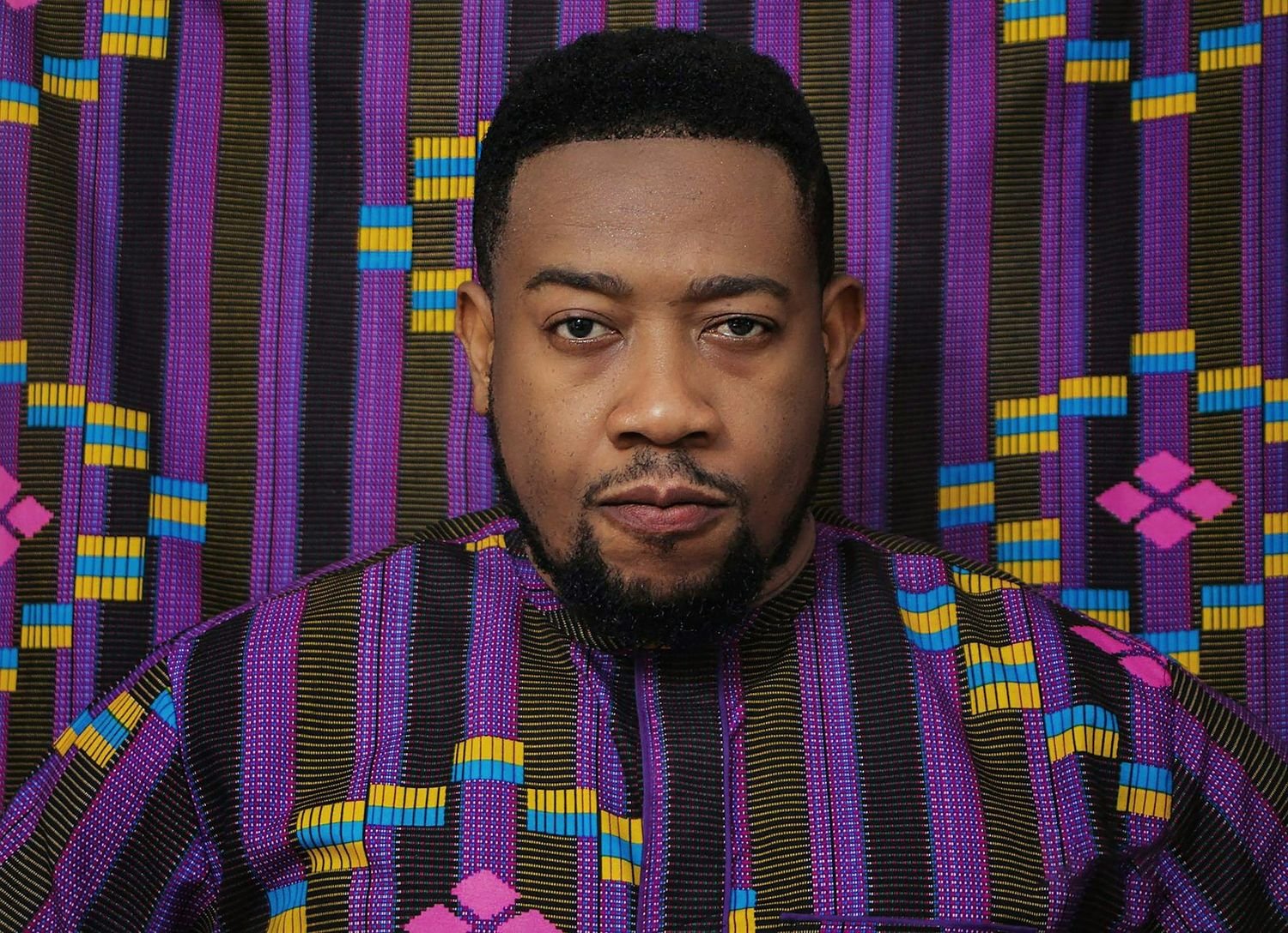 Portrait of a man in a purple patterned shirt